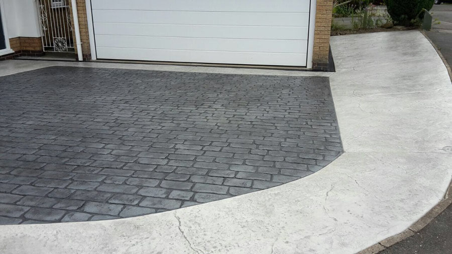 Pattern imprinted concrete driveway with curved path
